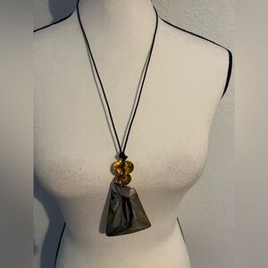 Norma Jean silver tone drop pendant with amber look beads on a brown leather!
